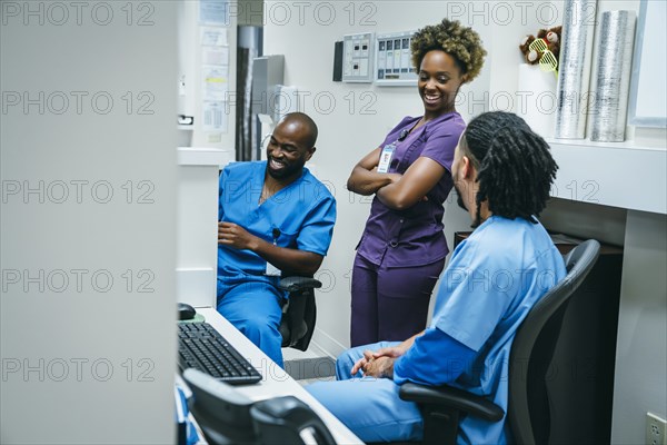 Nurses laughing in hospital