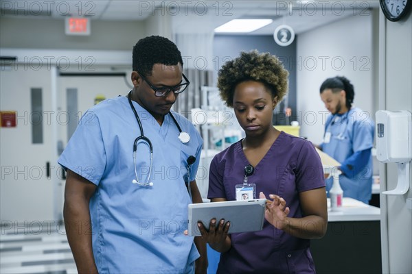 Nurse is using digital tablet in hospital