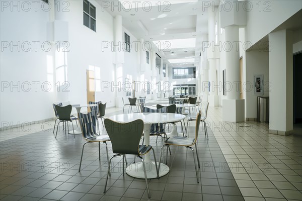 Empty table and chairs in lobby