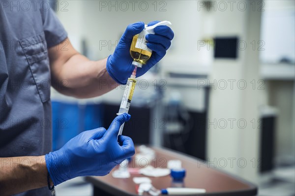 Mixed race nurse wearing rubber-gloves holding medicine and needle