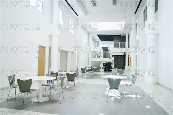 Tables and chairs in empty lobby