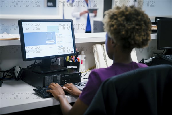 Nurse using computer in hospital