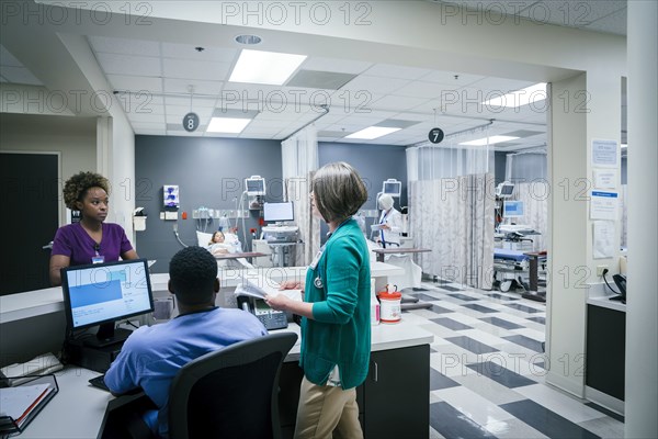 Doctor and nurses talking in hospital