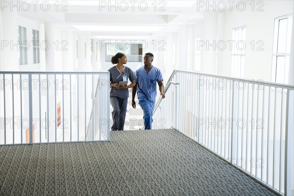 Nurses climbing staircase