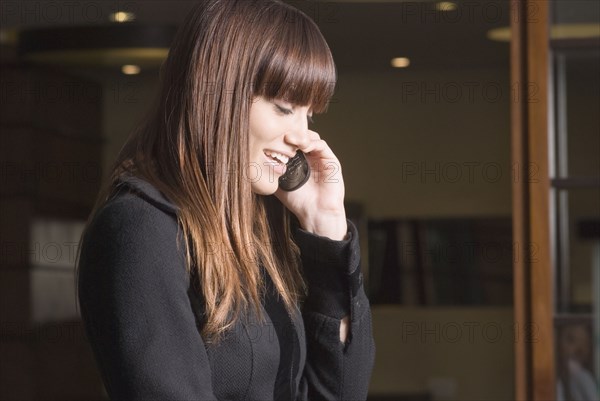 Young woman talking on cell phone