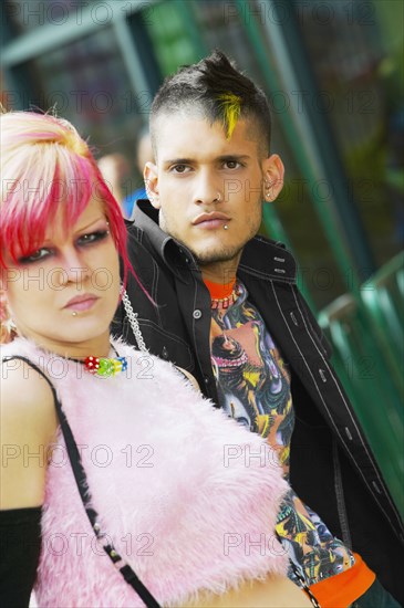 Close up of Hispanic punk couple outdoors