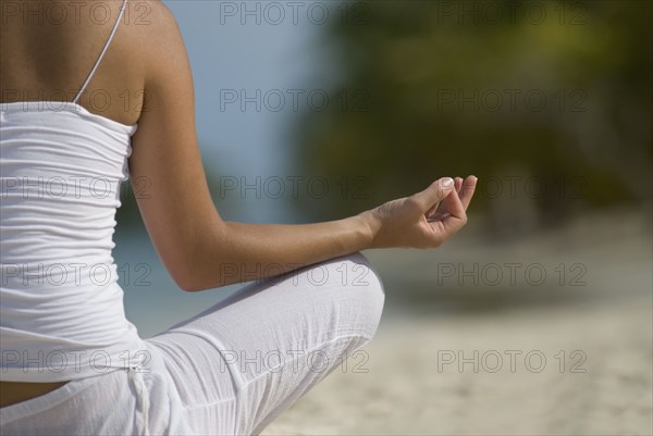 Hispanic woman meditating