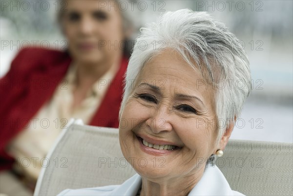 Close up of senior Hispanic woman smiling