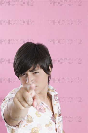 Young Hispanic man pointing