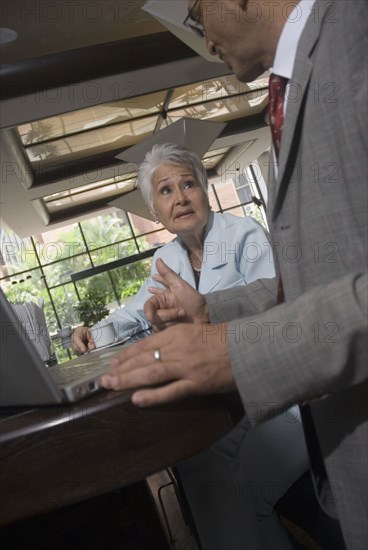 Hispanic businesspeople in cafe