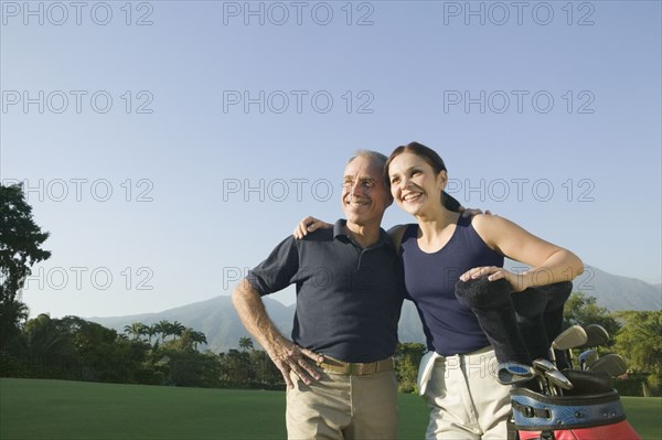 Hispanic couple on golf course