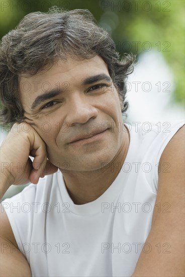 Confident Hispanic man smiling