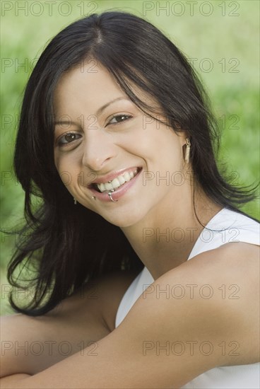 Smiling Hispanic woman with lip ring