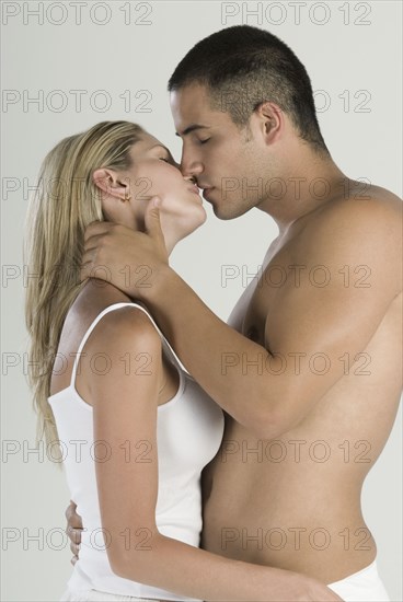 Hispanic couple kissing