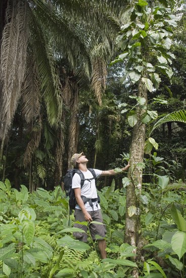 Hispanic man exploring jungle