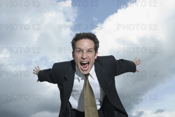 Angry Hispanic businessman shouting