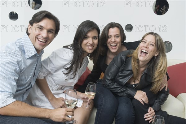 Hispanic friends drinking in nightclub