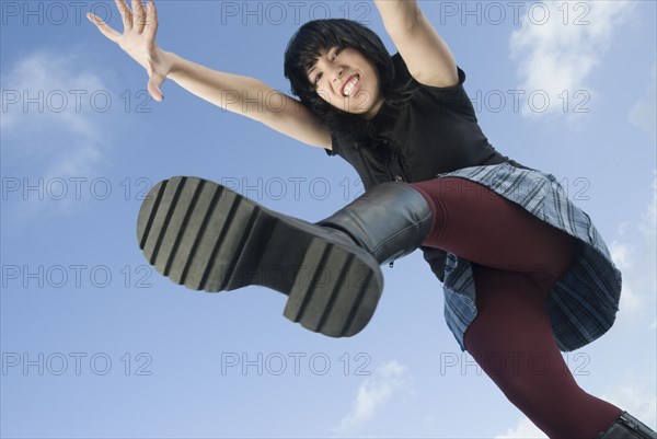 Angry Hispanic woman jumping
