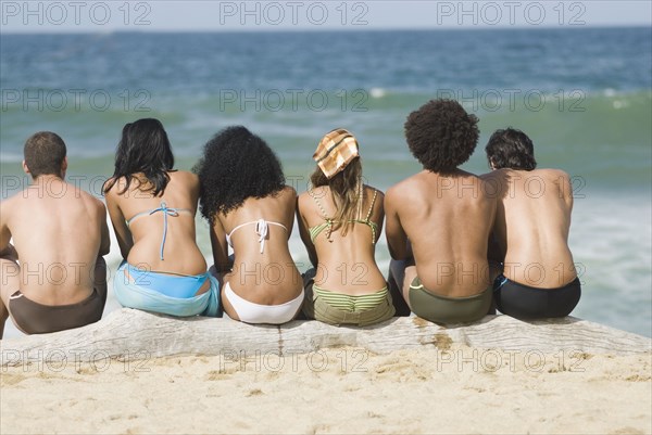 Multi-ethnic friends relaxing on beach