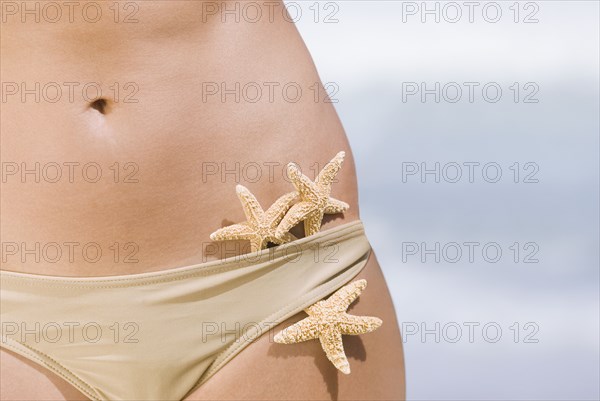 Starfish tucked into woman's bikini bottoms