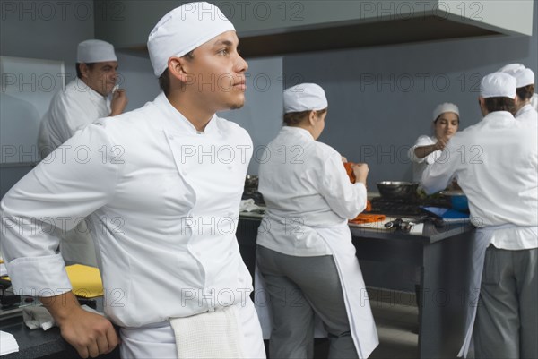 Bakers working in bakery kitchen