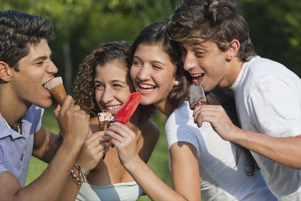 Hispanic friends eating ice cream together