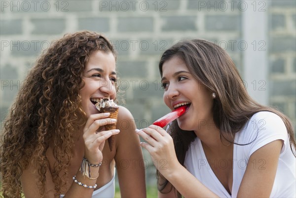 Hispanic friends eating ice cream together