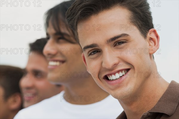 Friends standing a row