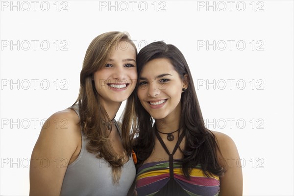 Smiling Hispanic sisters