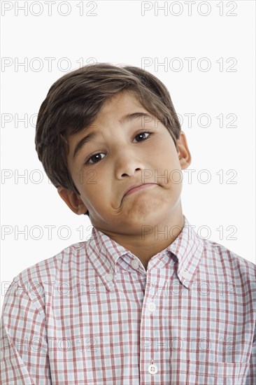 Uncertain Hispanic boy