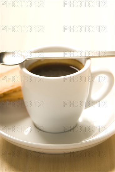 Cup of espresso with spoon