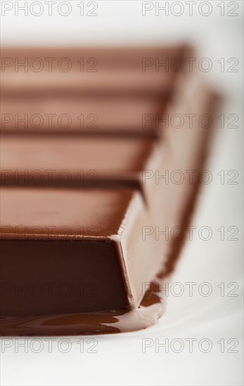 Melting bar of chocolate