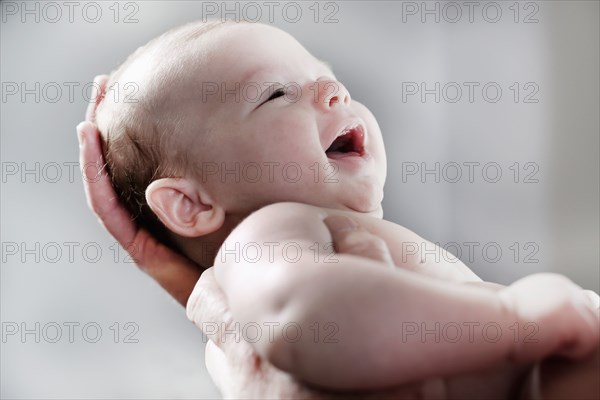 Close up of laughing baby boy
