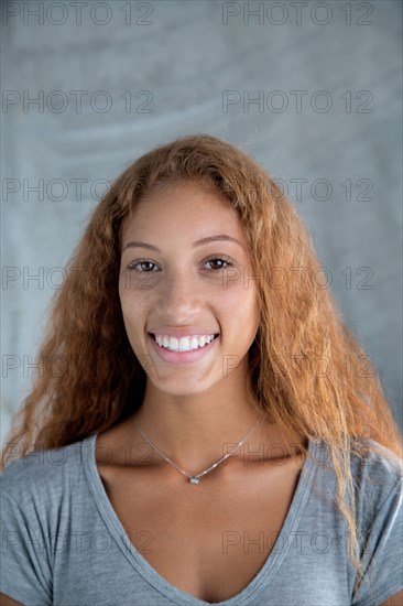 Portrait of smiling Mixed Race woman