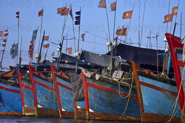 Vietnamese boats moored in harbor