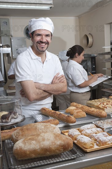 Hispanic baker working in commercial kitchen