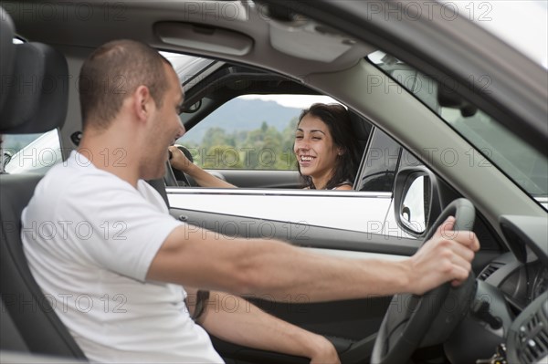 Hispanic drivers stopping to talk