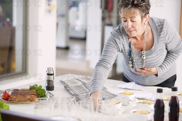 Hispanic woman preparing for party