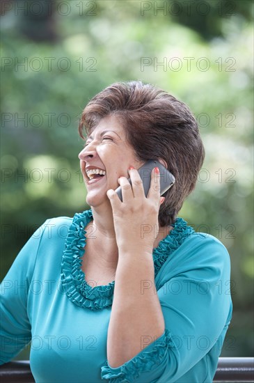 Hispanic woman talking on cell phone