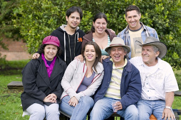 Hispanic family sitting together