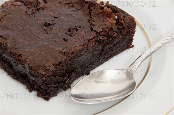 Close up of chocolate brownie and spoon