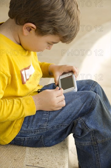 Hispanic boy playing video game