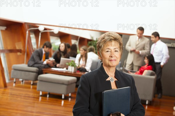 Hispanic business people in meeting together