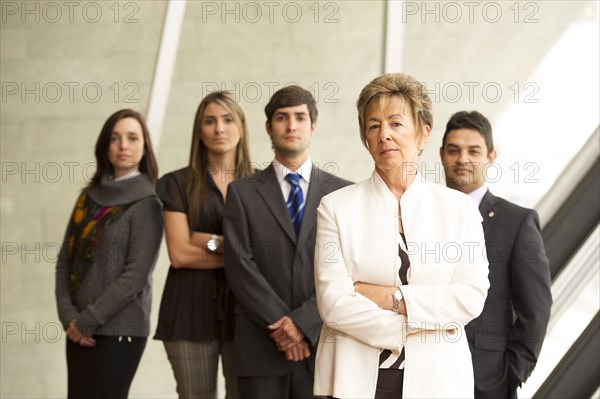 Hispanic business people standing together