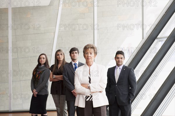 Hispanic business people standing together