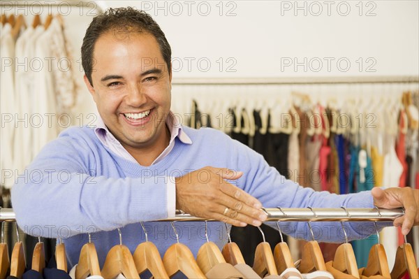 Hispanic man working in clothing store