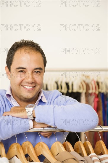 Hispanic man working in clothing store