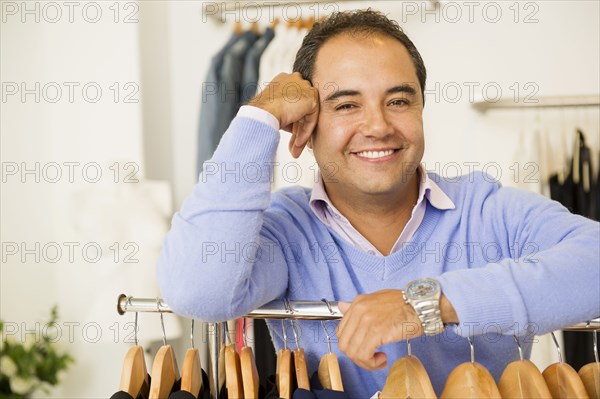 Hispanic man working in clothing store