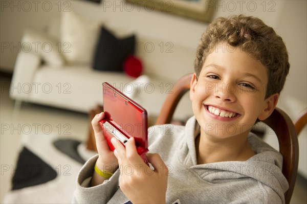 Hispanic boy playing video game