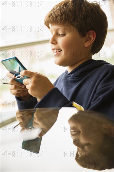 Hispanic boy playing video game